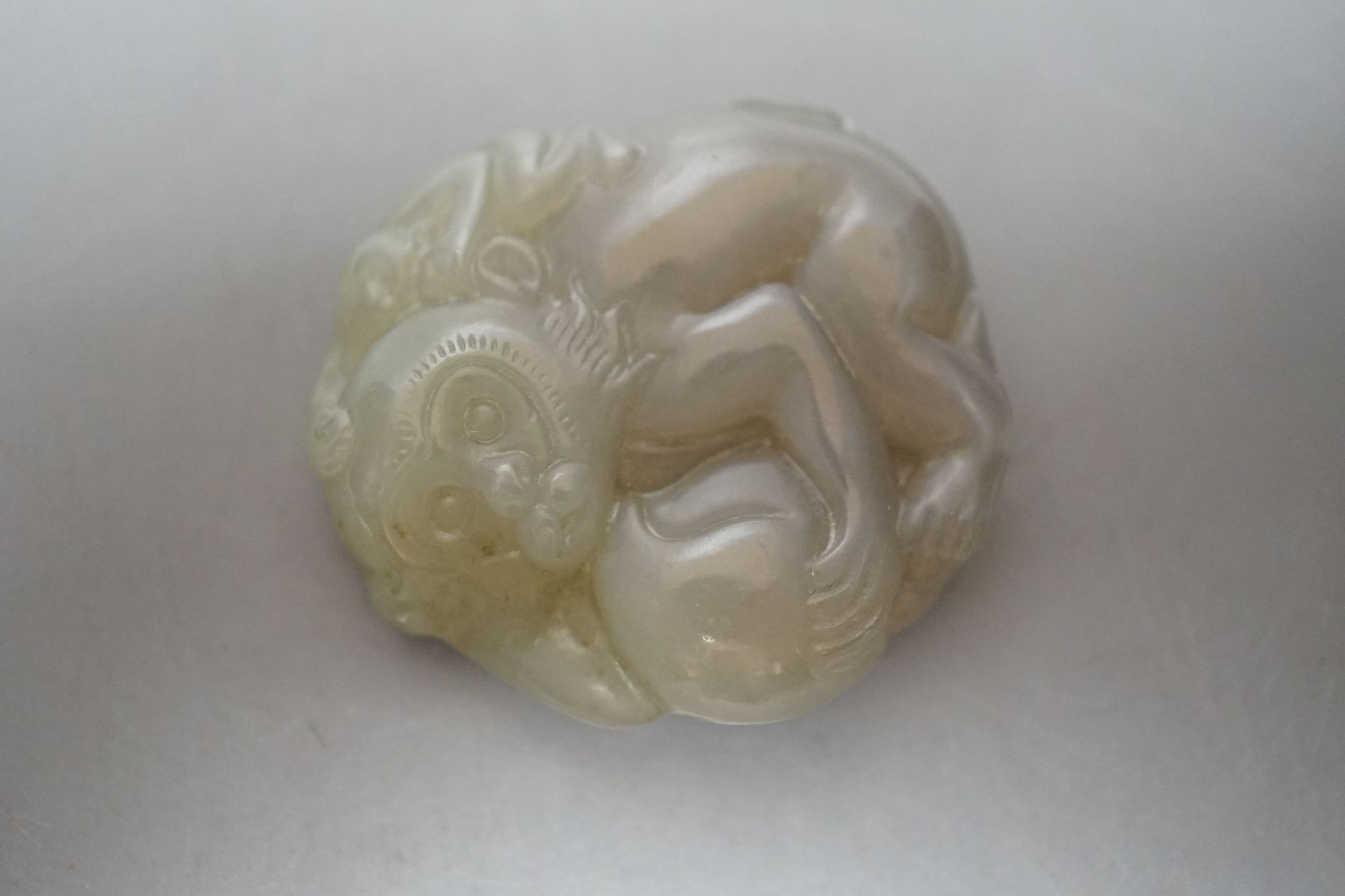 Four Chinese jade carvings of animals and fruit, tallest 4cm